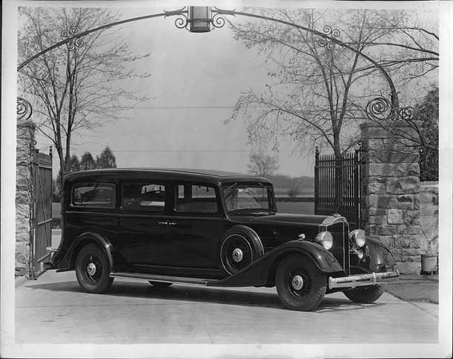 1934 Packard funeral coach at gate to Packard Proving Grounds