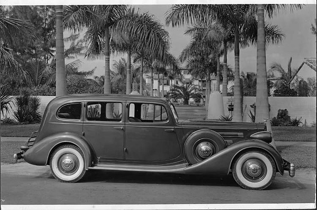 1935 Packard sedan, right side view, parked on street