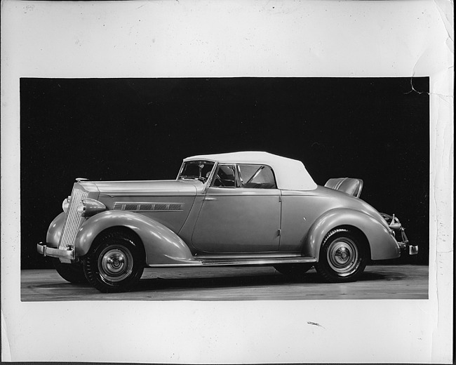 1935 Packard convertible coupe, top raised, rumble seat open