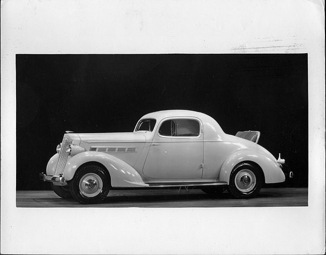 1935 Packard sport coupe, nine-tenths left side view, rumble seat open