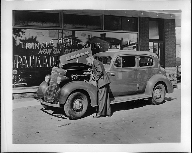1935 Packard touring coupe, Mr. Harry S. Trinkle looking under hood