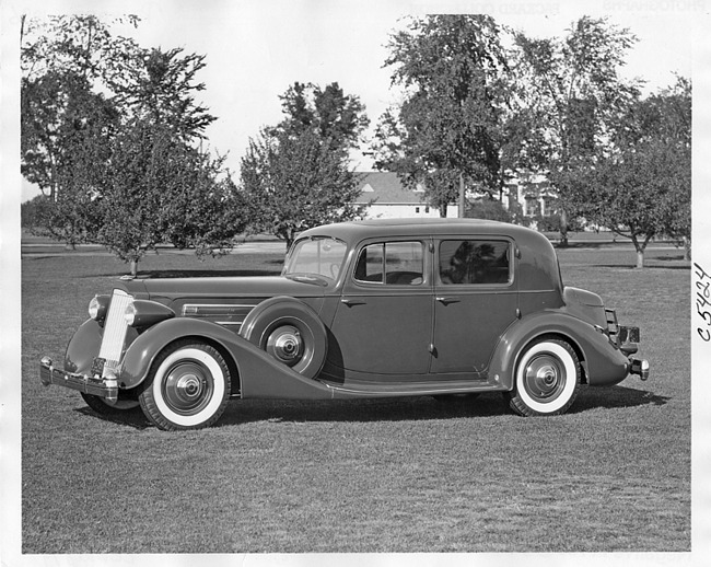 1936 Packard club sedan, seven-eights left side view, parked on grass