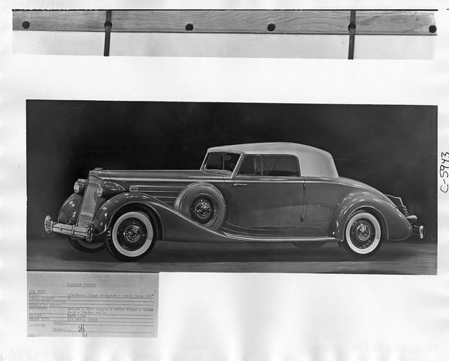 1936 Packard coupe roadster, seven-eights left side view, top raised