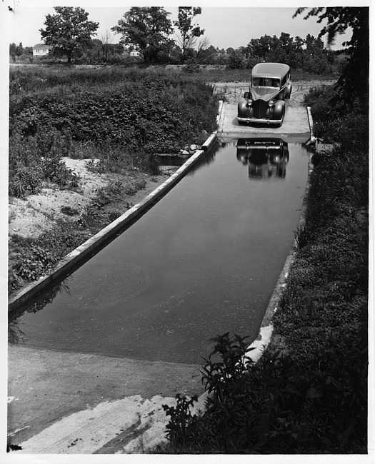 1937 Packard at Packard Proving Grounds on water-covered road