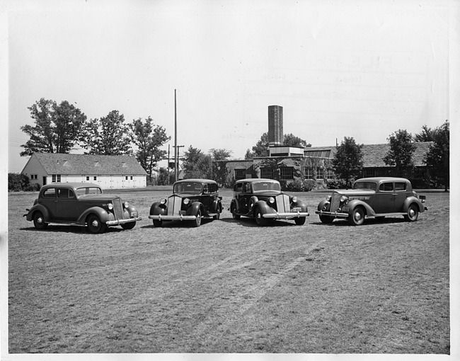 1937 Packards parked on grass at Packard Proving Grounds