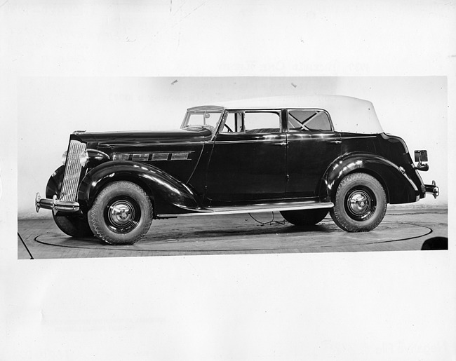 1937 Packard convertible sedan, nine-tenths left side view, top raised