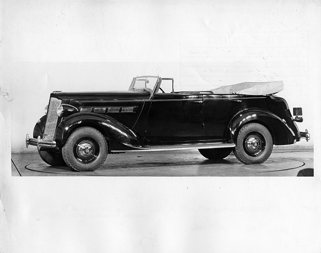 1937 Packard convertible sedan on display in dealership showroom