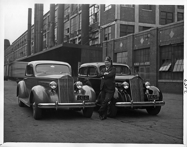 1937 Packard one twenties with owner at the Packard plant