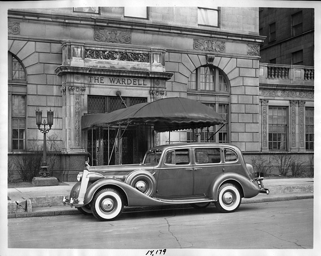 1937 Packard touring sedan, parked on street in front of The Wardell