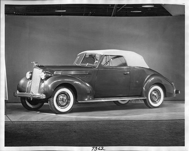 1938 Packard convertible coupe, nine-tenths left side view, top raised