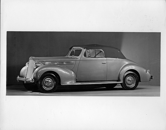 1938 Packard convertible coupe, seven-eights left side view, top raised