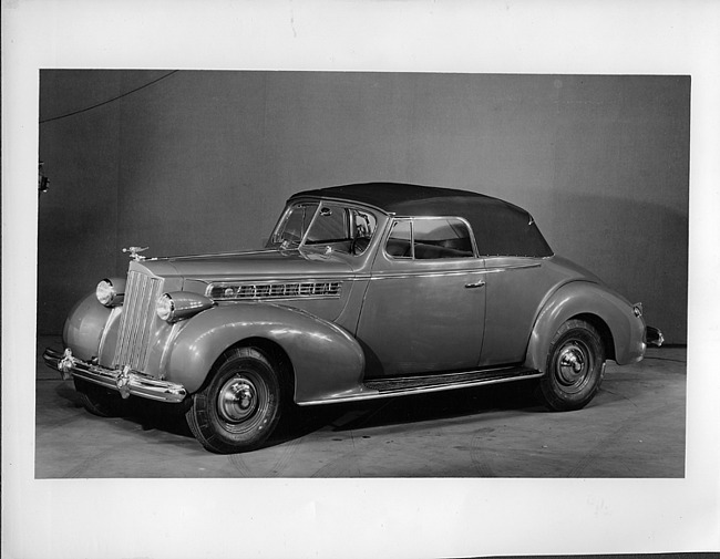 1939 Packard convertible coupe, seven-eights left side view, top raised