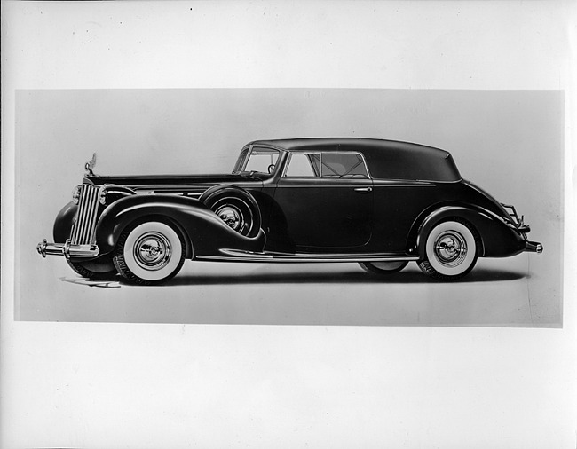 1939 Packard convertible victoria, nine-tenths left side view, top raised