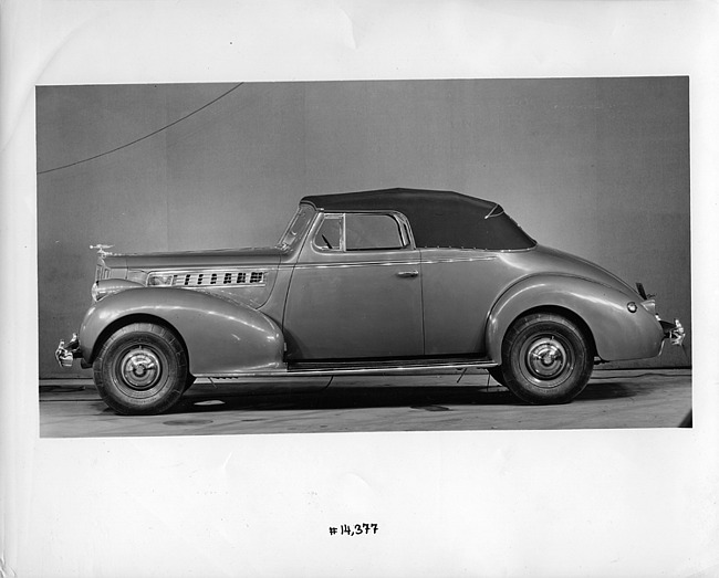 1939 Packard convertible coupe, left side view, top raised