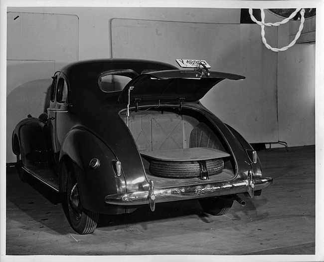 1940 Packard business coupe, rear view showing inside of trunk and spare tire