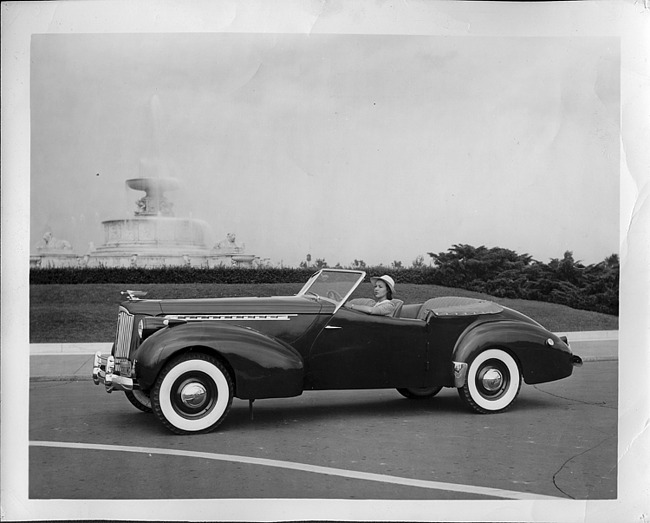 1940 Packard convertible victoria, female behind wheel, by Scott fountain