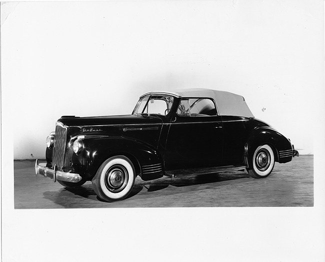 1941 Packard deluxe convertible coupe, seven-eights left side view, top raised