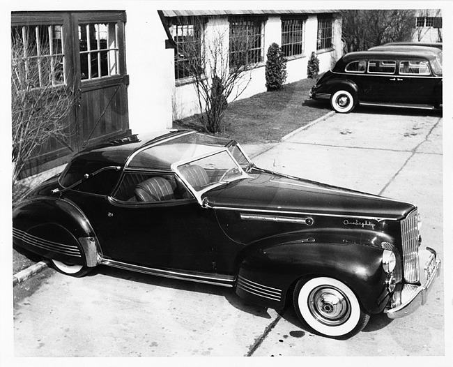 1941 Packard convertible victoria, nine-tenths right side view, top raised