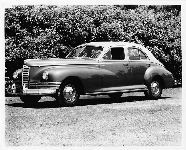 1946 Packard Clipper sedan, seven-eights left side view, parked on grass