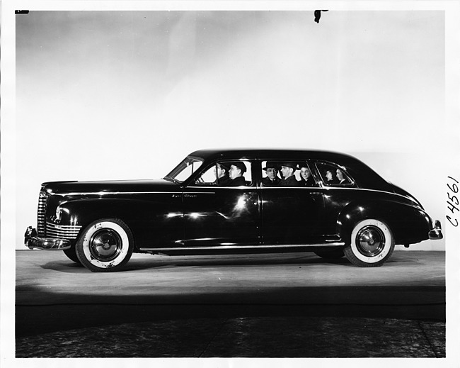 1946 Packard Clipper limousine full of passengers, on display