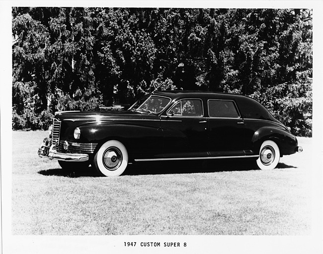 1947 Packard sedan, nine-tenths left side view, parked on grass