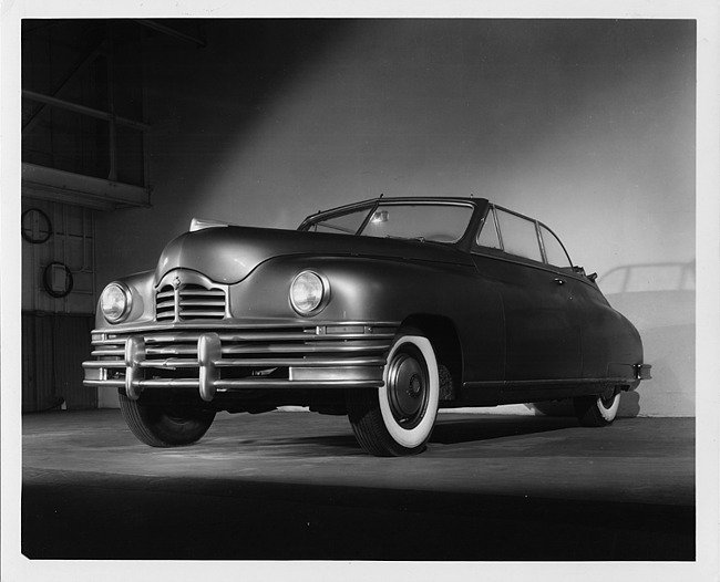 1947 Packard convertible, three-quarter front view from below, dual white sidewall tires