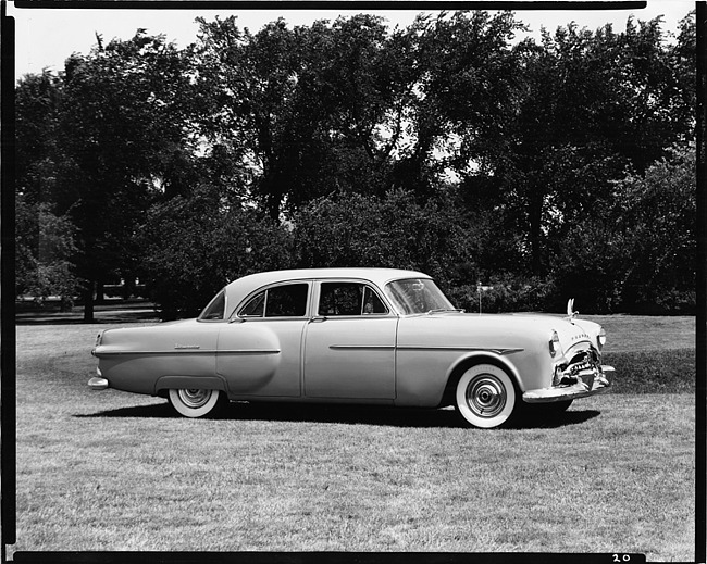 1951 Packard sedan, nine-tenths right side view, parked on grass