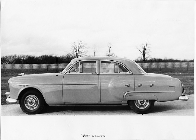1951 Packard 200 deluxe sedan, left side view, parked on drive
