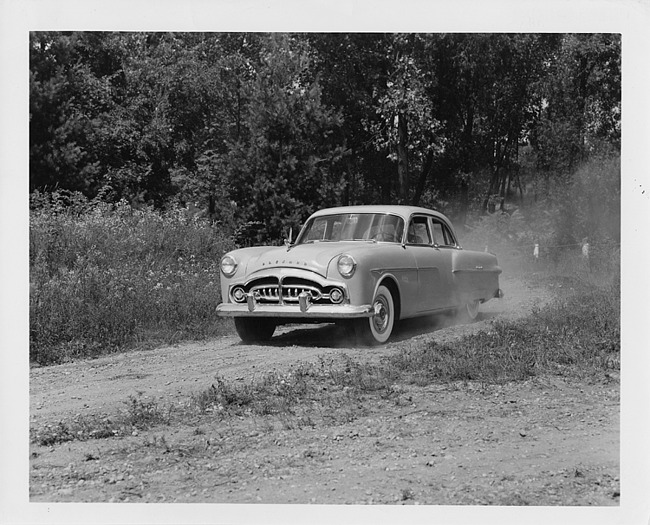 1951 Packard 300, three-quarter front view, on country dirt road