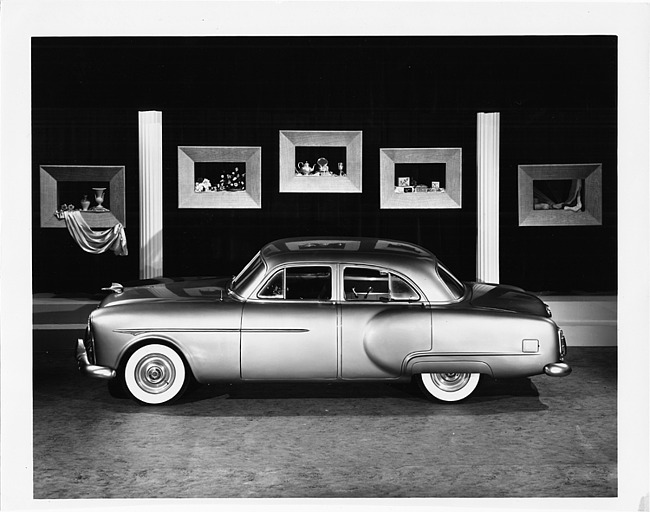 1951 Packard 200 sedan, left side view, on display