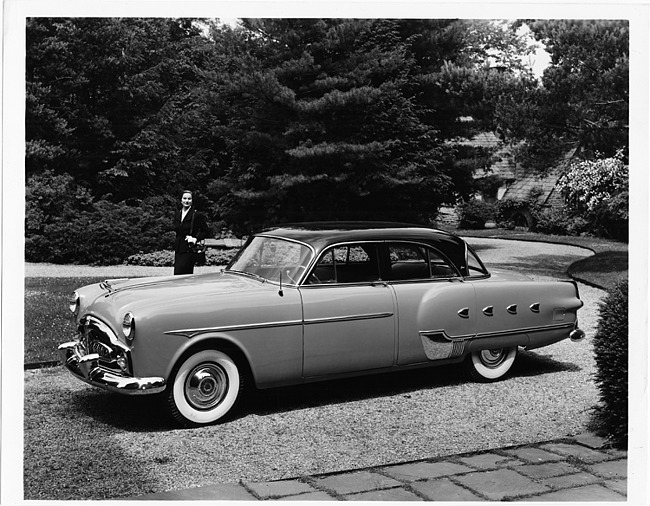 1952 Packard patrician 400 parked in driveway, female in background