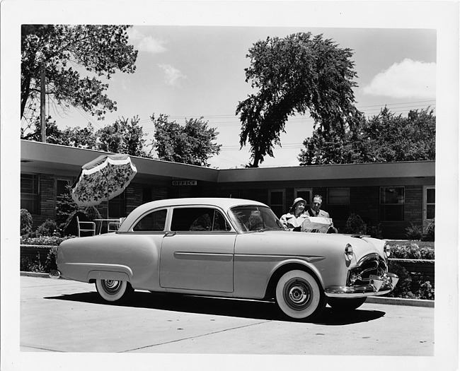 1952 Packard 200 club sedan with couple looking at map