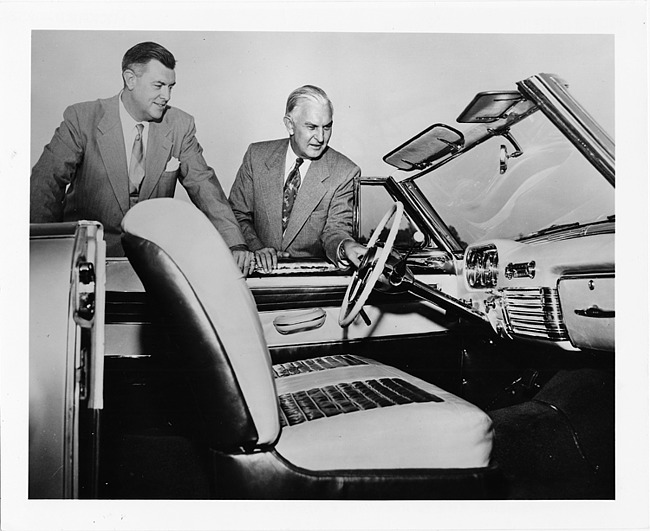 1952 Packard Pan American sports car, view of interior, two men standing at driver's door