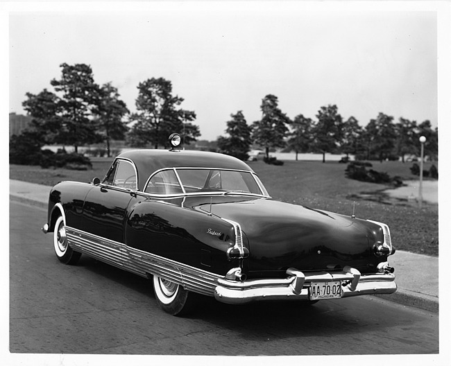 1952 Packard special speedster, three-quarter rear view, parked on drive