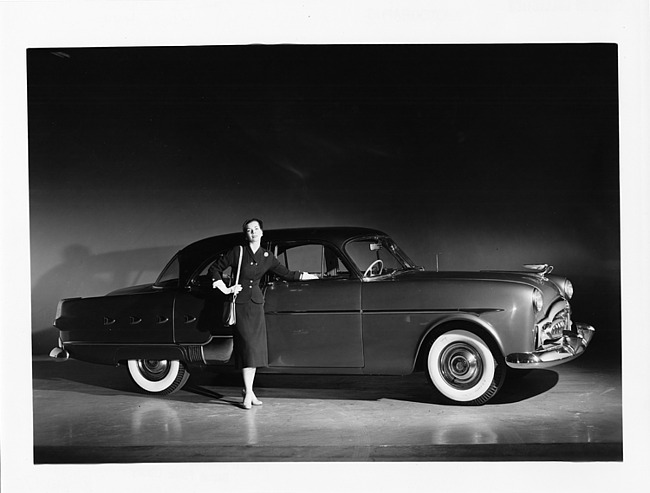 1952 Packard 400 patrician, female standing at front passenger door