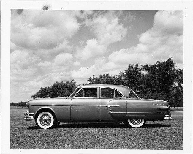 1954 Packard Patrician, left side view, parked on grass