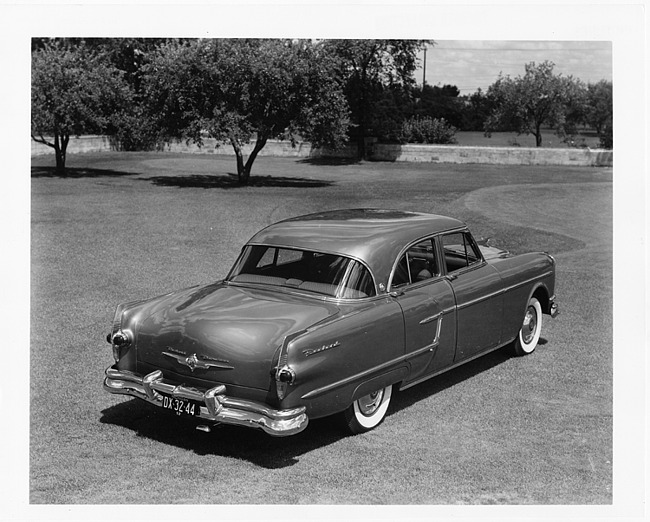 1954 Packard Patrician, three-quarter rear right view, parked on grass