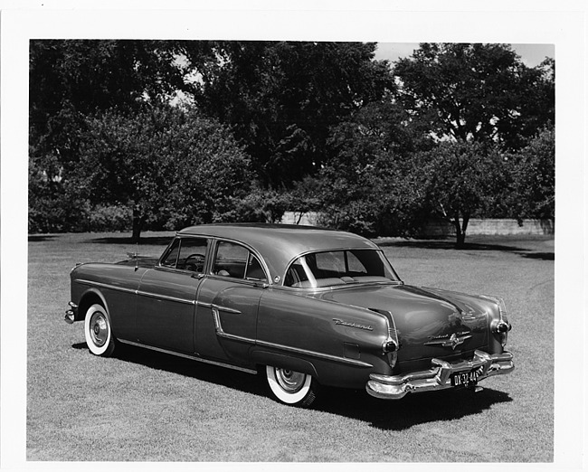 1954 Packard Patrician, three-quarter rear left view, parked on grass