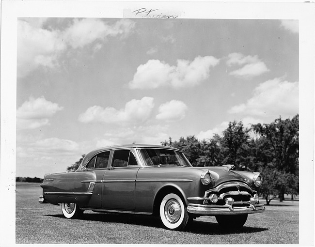 1954 Packard Patrician, three-quarter front right view, parked on grass