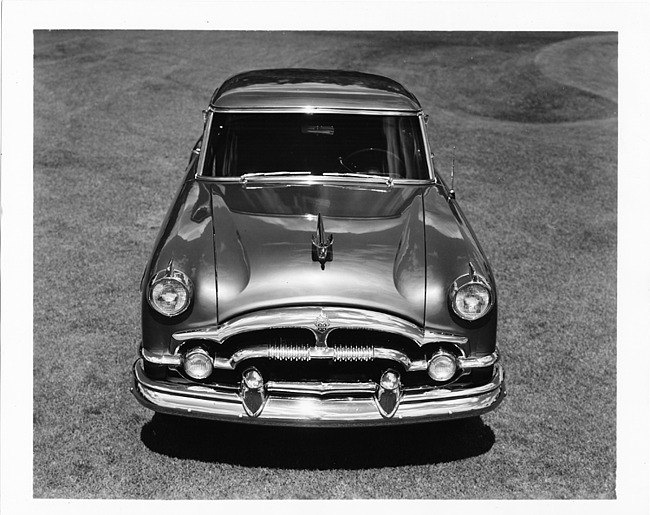 1954 Packard sedan, elevated front view, parked on grass