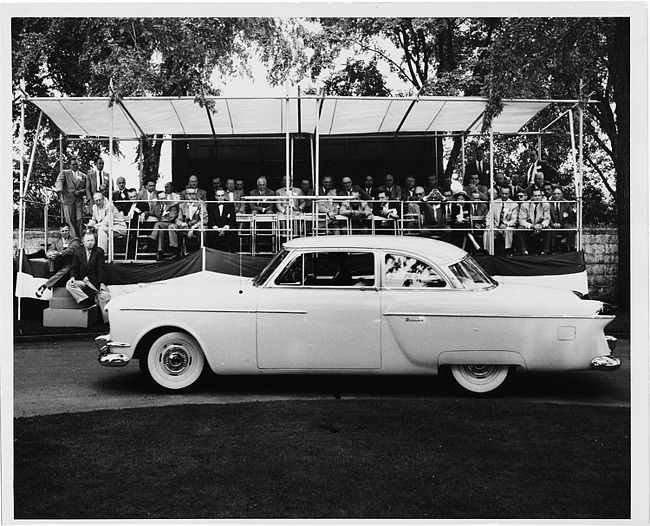 1954 Packard sportster, left side view, parked in front of reviewing stand