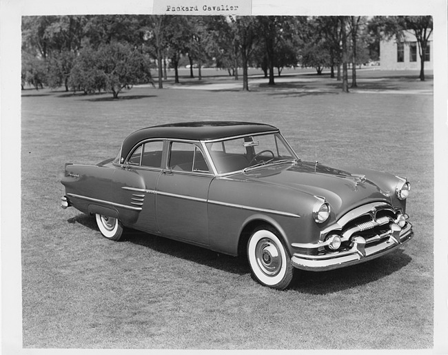 1954 Packard Cavalier, three-quarter right front view, parked on grass