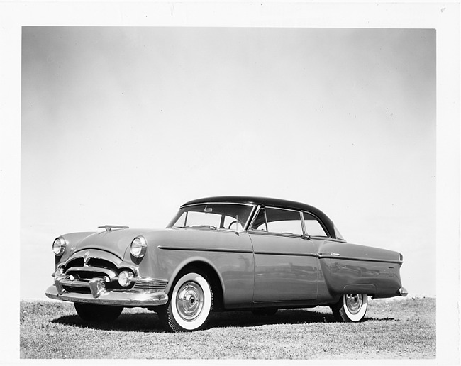 1954 Packard Panther Patrician, seven-eights left side view, parked on grass