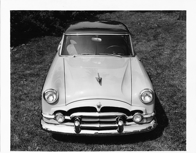 1954 Packard sedan, front view, parked on grass