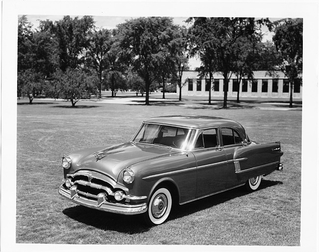 1954 Packard 4-door sedan, three-quarter left side view, parked on grass