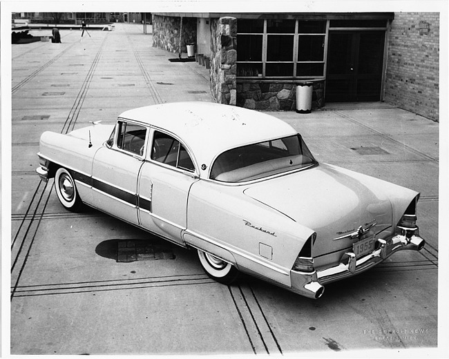 1955 Packard 4-door sedan, three-quarter rear left view, parked on drive