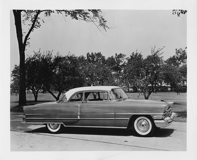 1956 Packard sedan, right side view, parked on drive