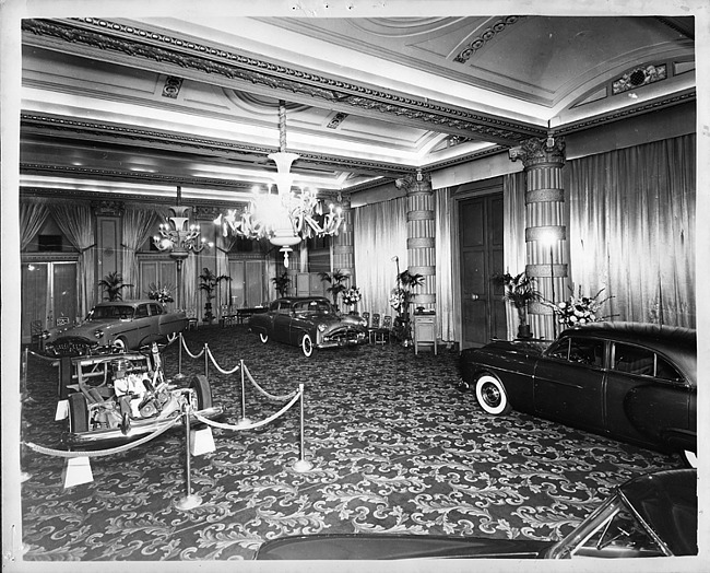 1950 salon showing in Philadelphia of three 1950 Packards and a bare chassis