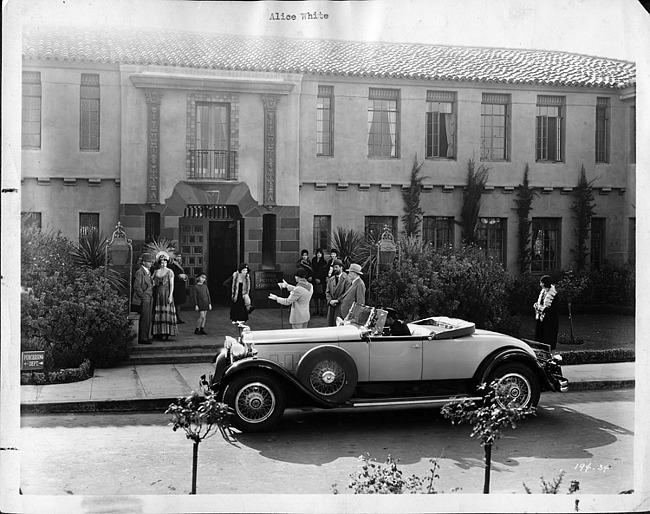1930 Packard roadster and Alice White, in a scene from 'A Show Girl in Hollywood'