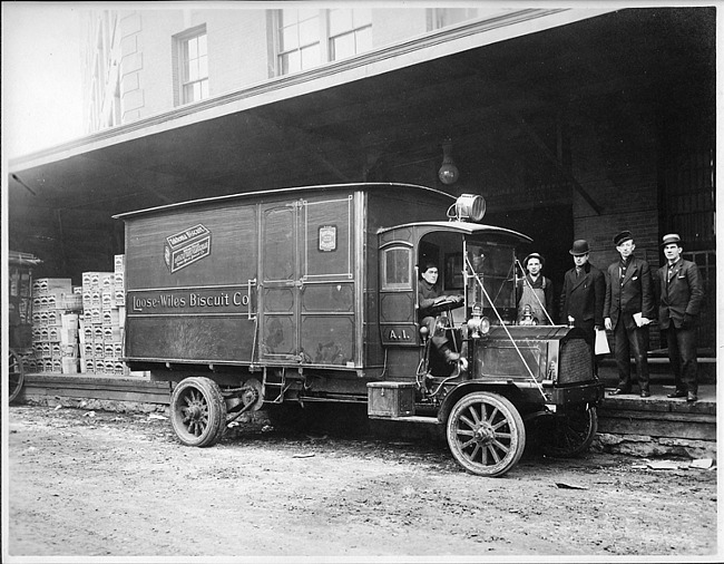 Early 1900s Packard truck, parked at loading dock
